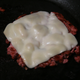 italian sausage grilling on pan